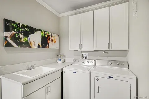 a spacious bathroom with a double vanity sink a mirror and a shower