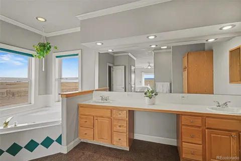 a bathroom with a toilet a sink a mirror and vanity