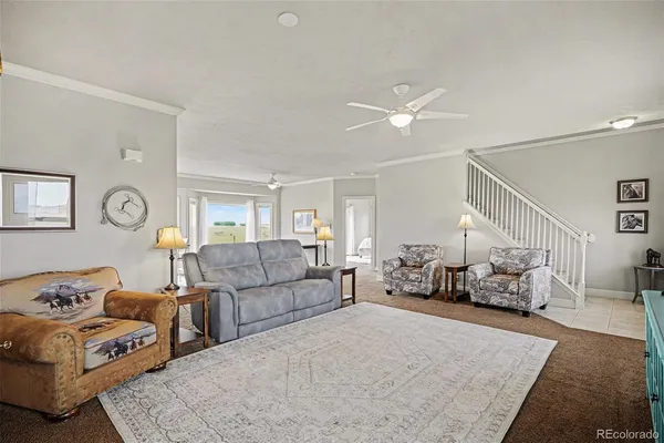 a kitchen with stainless steel appliances kitchen island granite countertop a sink a stove and a refrigerator