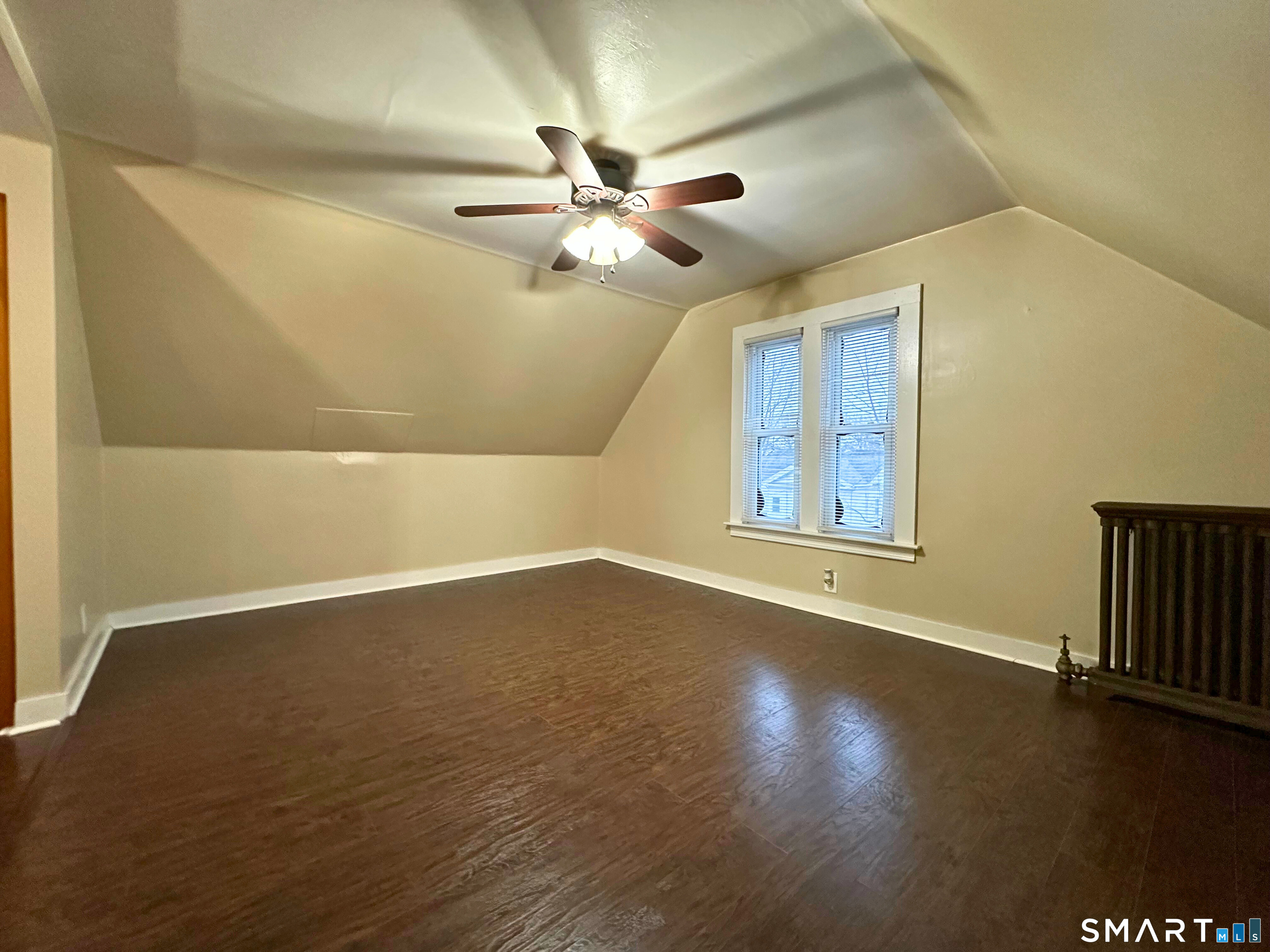 11 West Street New London, CT 06320 - Photo 14 of 24 a view of an empty room with wooden floor and a window