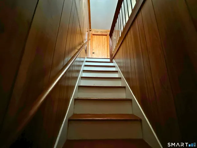 a view of gallery with wooden floor