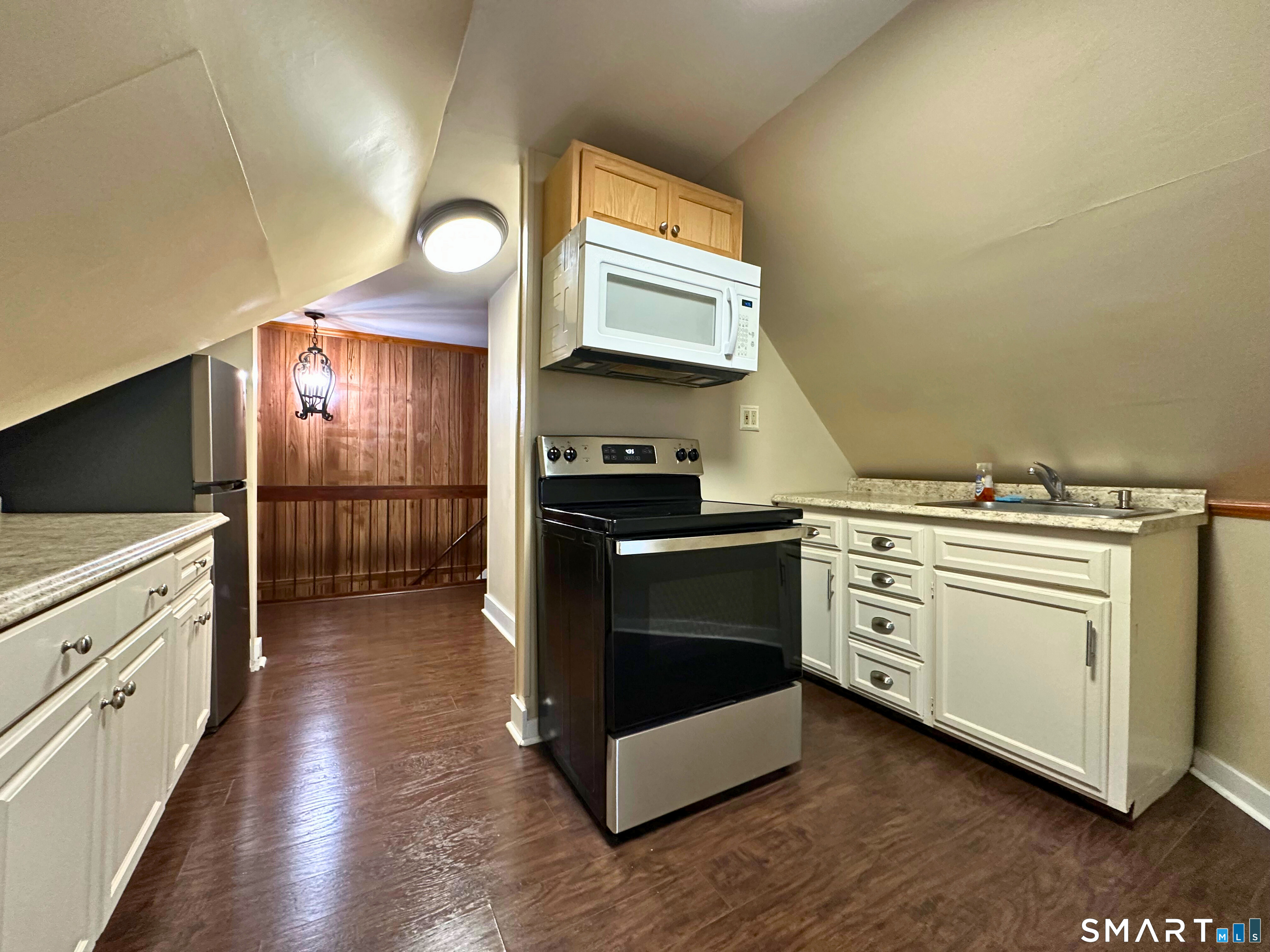 11 West Street New London, CT 06320 - Photo 9 of 24 a kitchen with a stove and a refrigerator