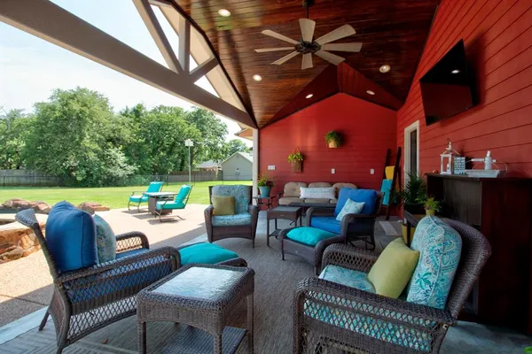 a outdoor living space with furniture and a fireplace