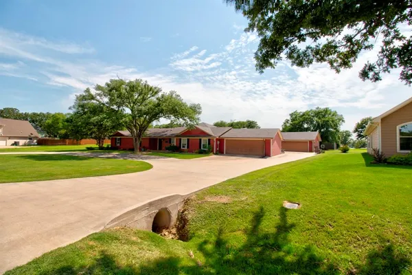 a view of a house with a big yard