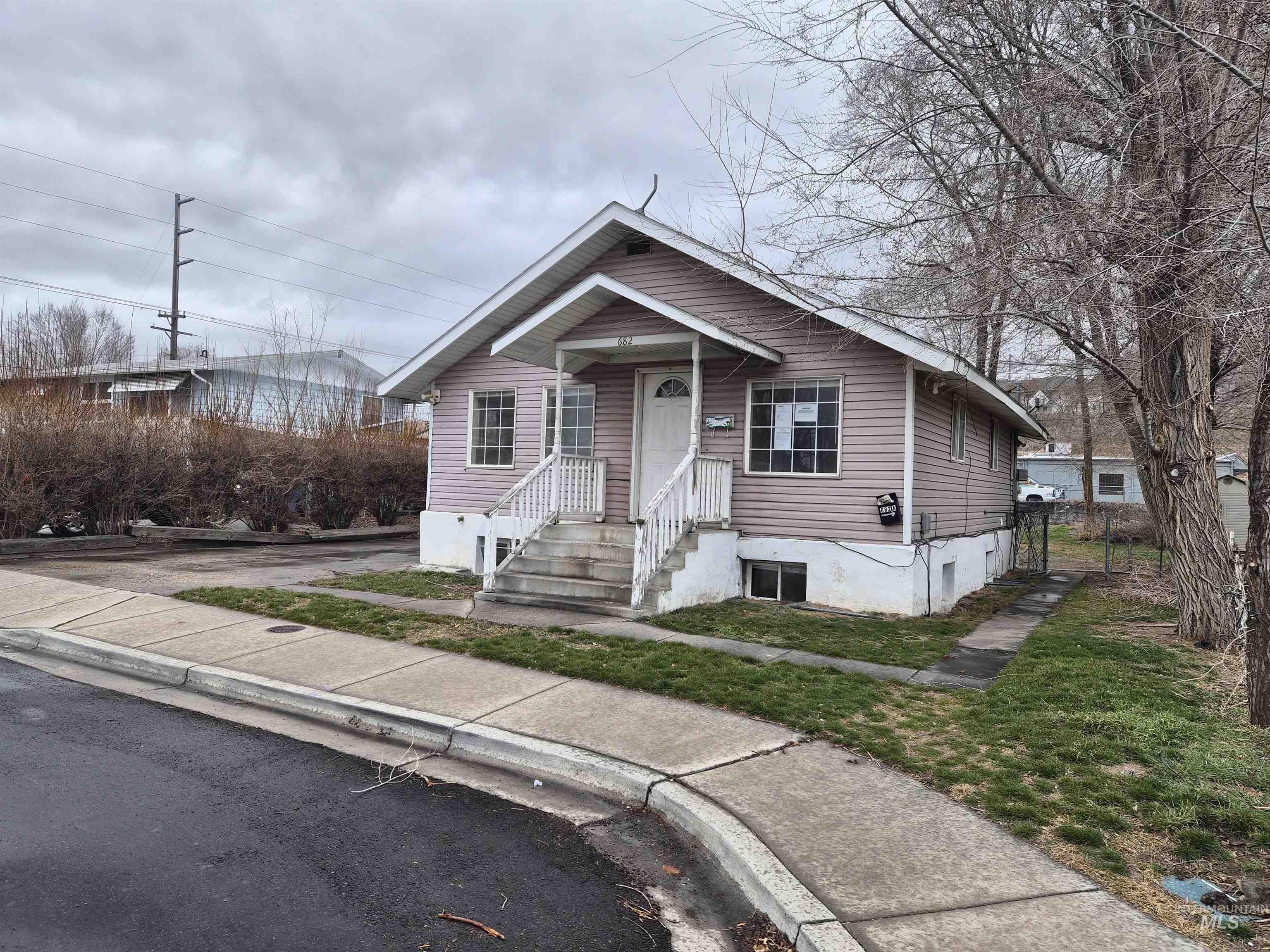 Bungalow-style house with a front yard