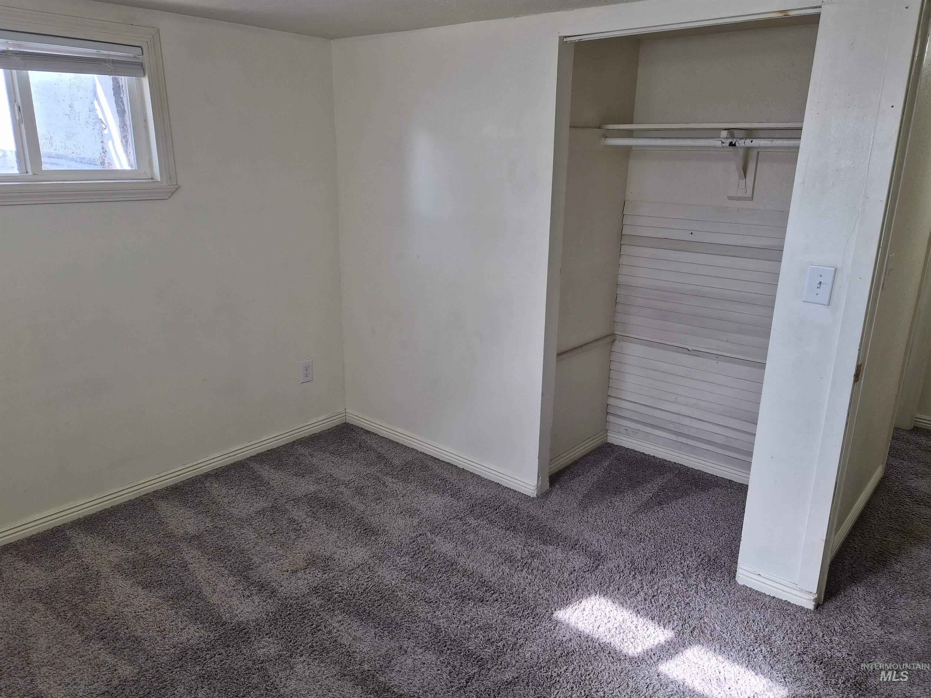 682 Randolph Avenue Pocatello, ID 83201 - Photo 18 of 29 Unfurnished bedroom with carpet flooring and a closet
