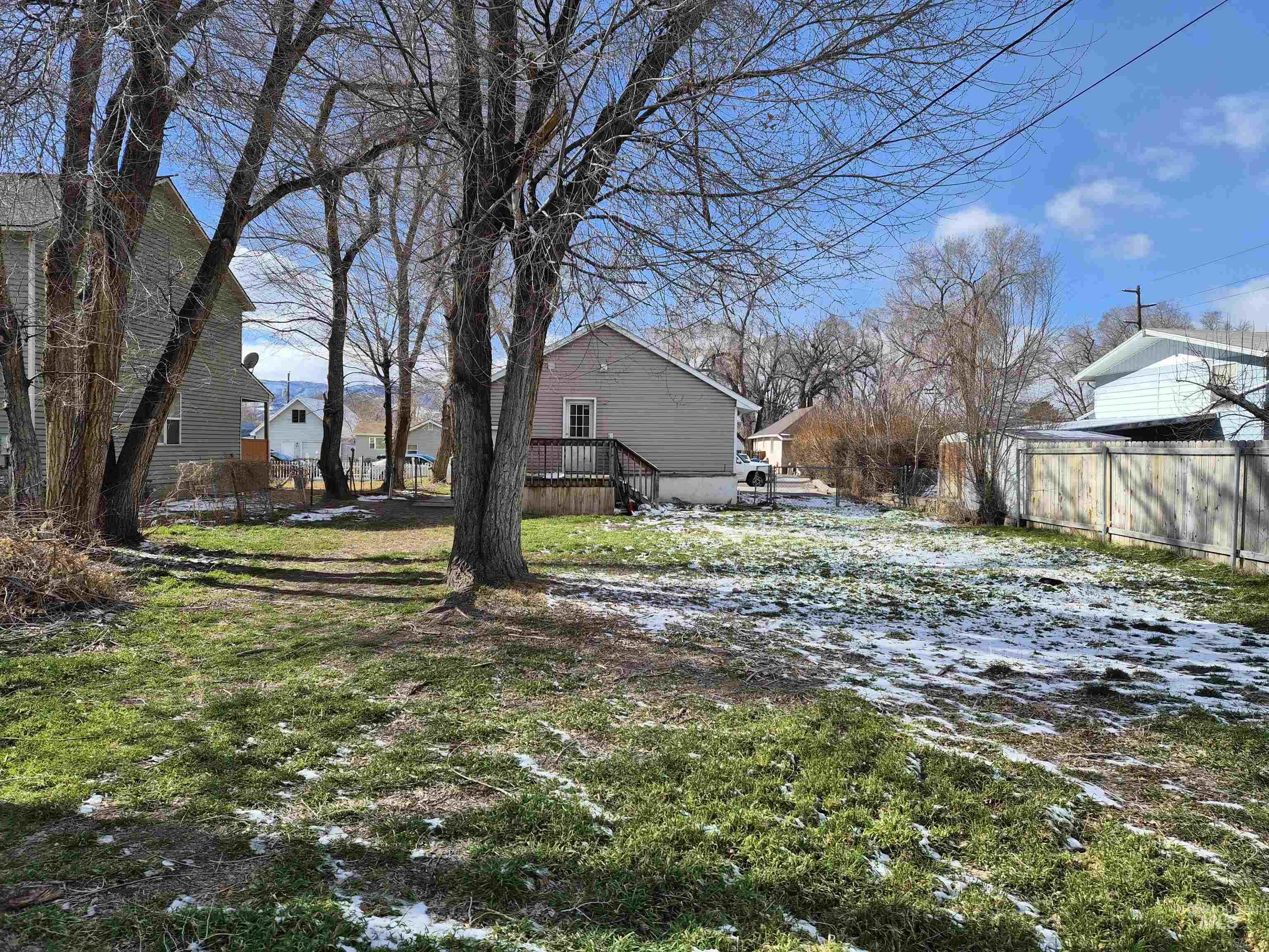682 Randolph Avenue Pocatello, ID 83201 - Photo 22 of 29 Yard covered in snow featuring a wooden deck