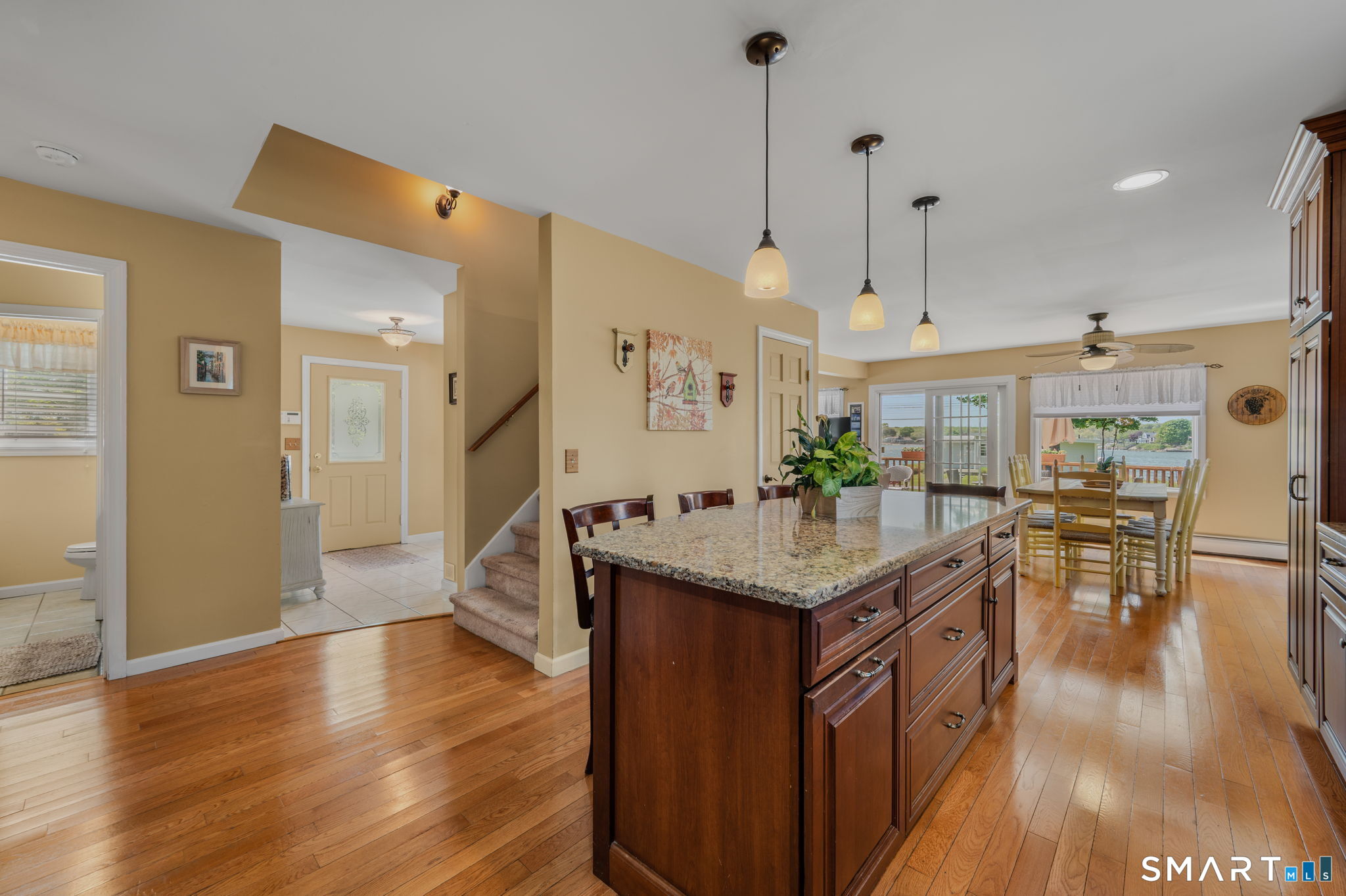 212 R Shore Road Waterford, CT 06385 - Photo 13 of 28 a kitchen with granite countertop a counter space and wooden floor