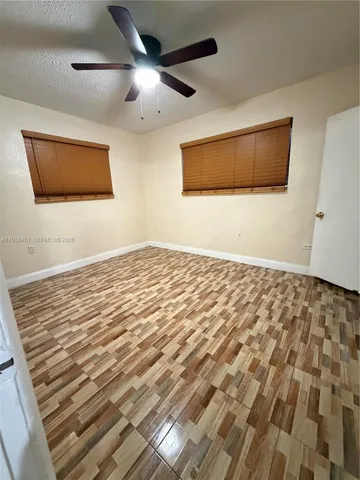 a view of a livingroom with wooden floor