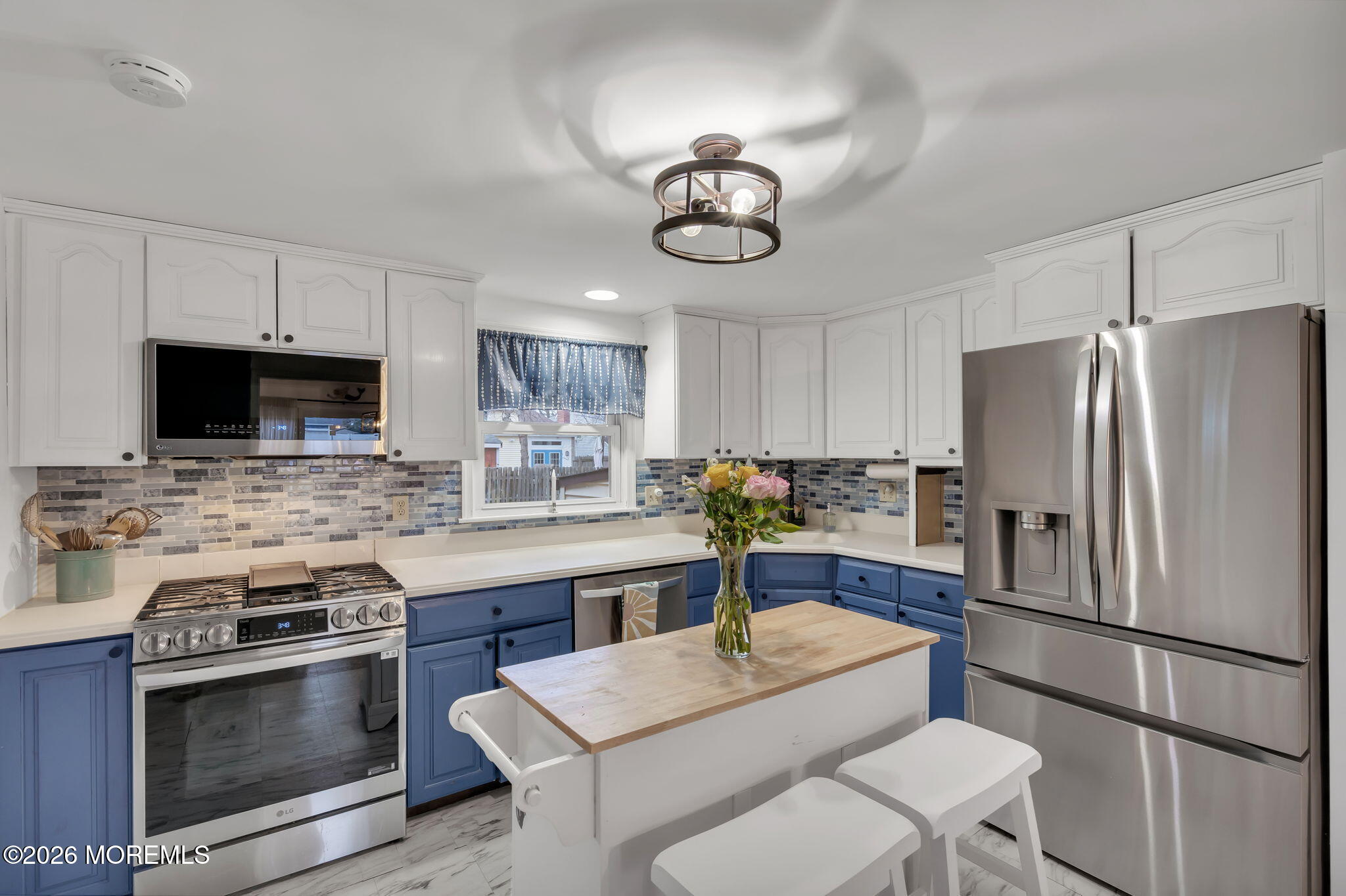 1129 Roe Avenue Point Pleasant, NJ 08742 - Photo 15 of 71 a kitchen with stainless steel appliances a stove a sink and a refrigerator