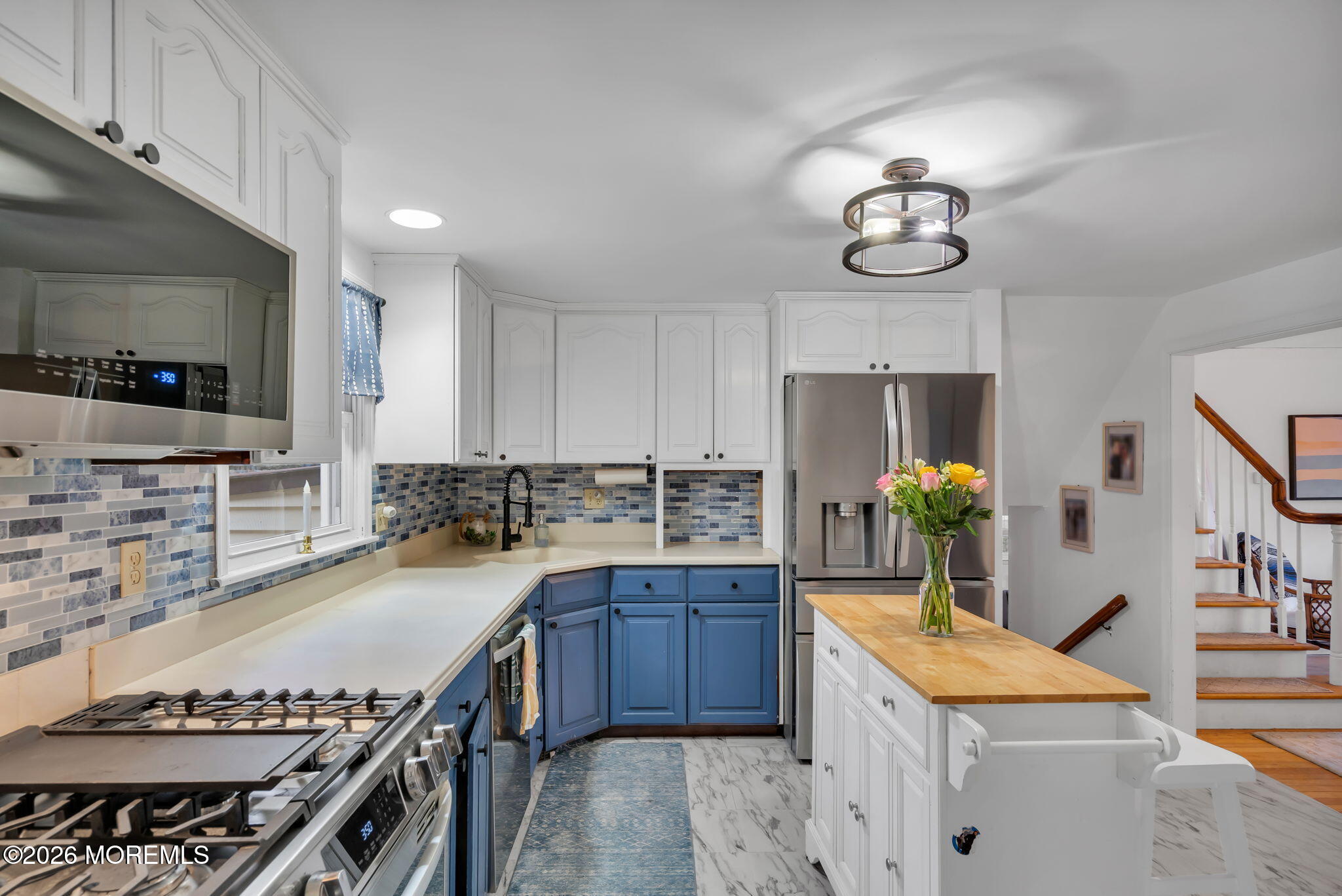 1129 Roe Avenue Point Pleasant, NJ 08742 - Photo 16 of 71 a kitchen with a sink stove and cabinets