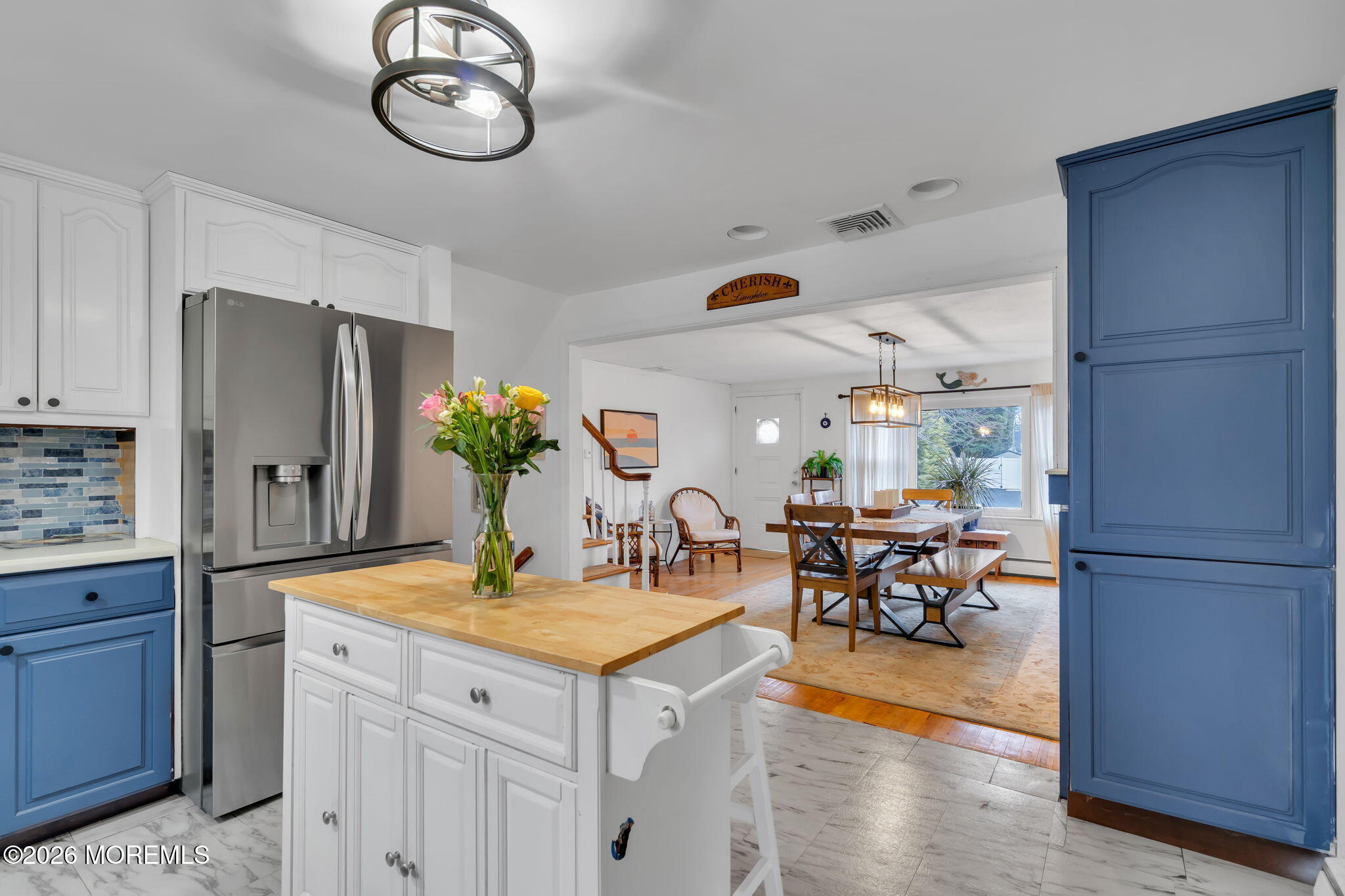 1129 Roe Avenue Point Pleasant, NJ 08742 - Photo 18 of 71 a kitchen with stainless steel appliances granite countertop a dining table chairs and granite counter tops