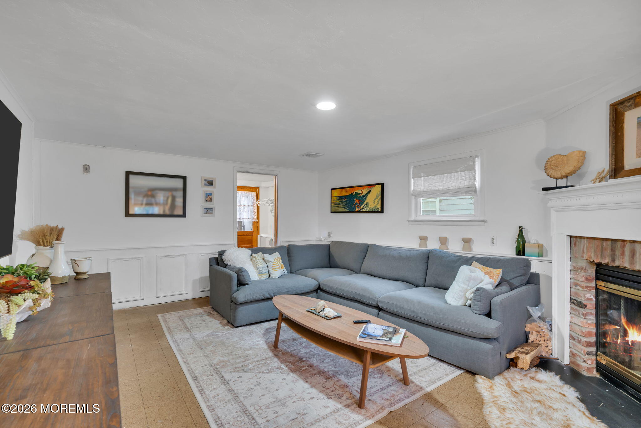 1129 Roe Avenue Point Pleasant, NJ 08742 - Photo 23 of 71 a living room with furniture a fireplace and a window
