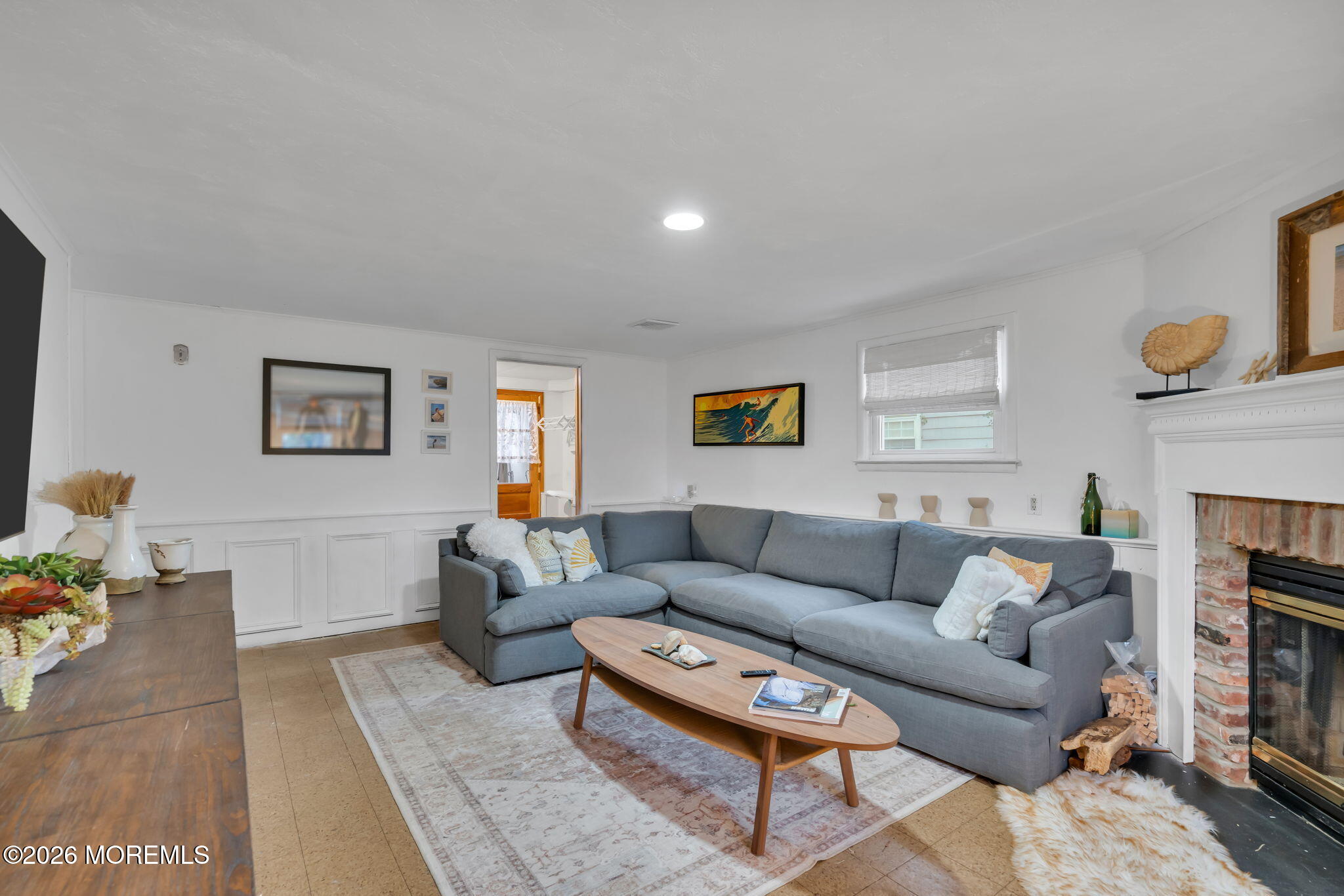 1129 Roe Avenue Point Pleasant, NJ 08742 - Photo 24 of 71 a living room with furniture a fireplace and a window