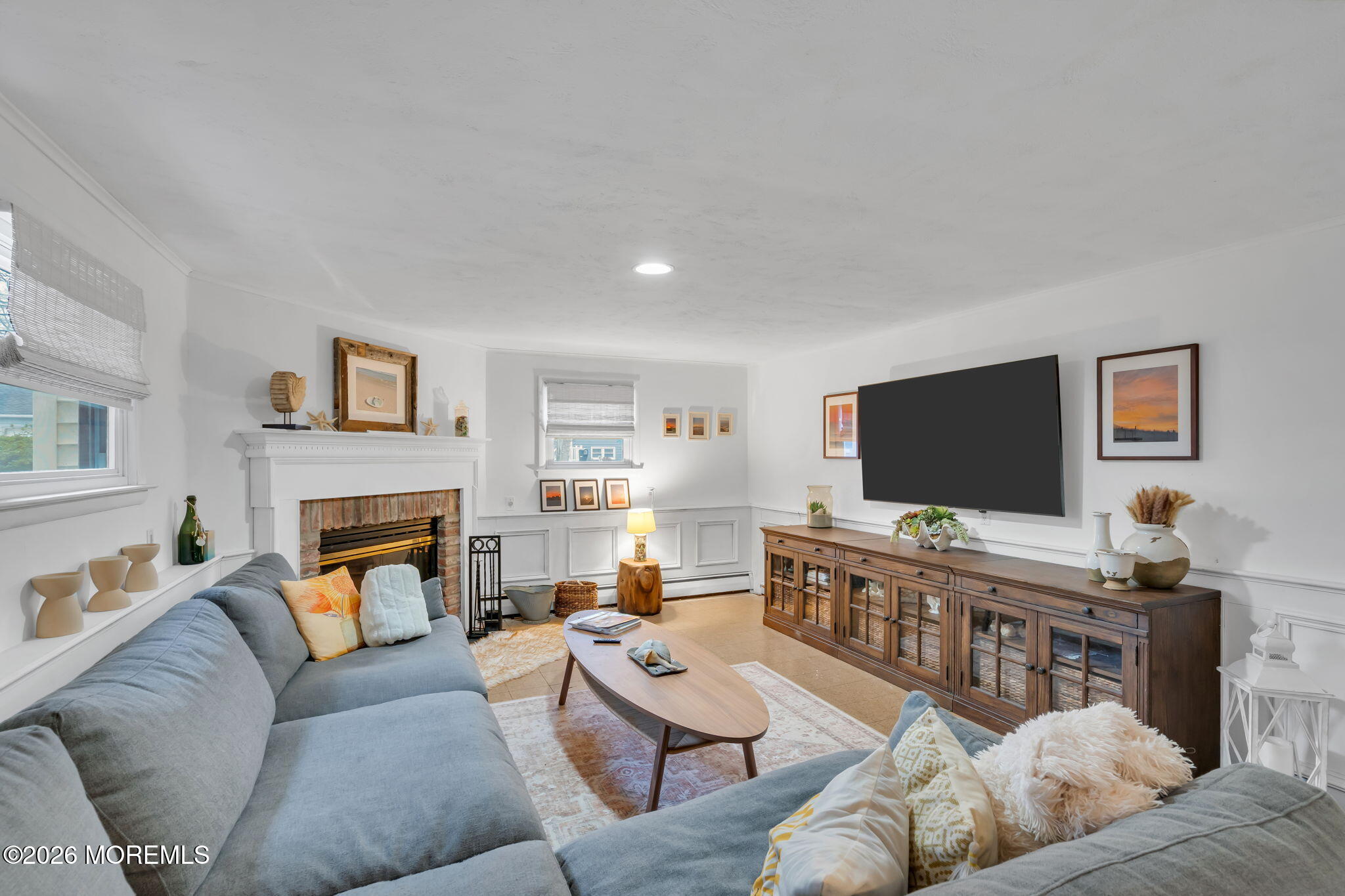 1129 Roe Avenue Point Pleasant, NJ 08742 - Photo 26 of 71 a living room with furniture a flat screen tv and a fireplace