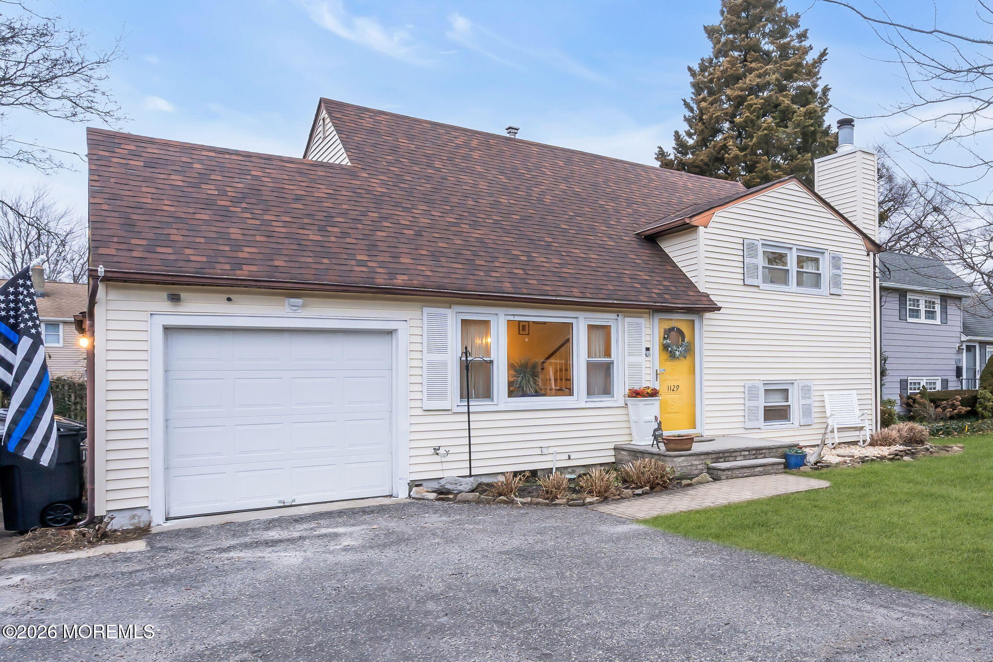 1129 Roe Avenue Point Pleasant, NJ 08742 - Photo 3 of 71 a front view of a house with a yard and garage