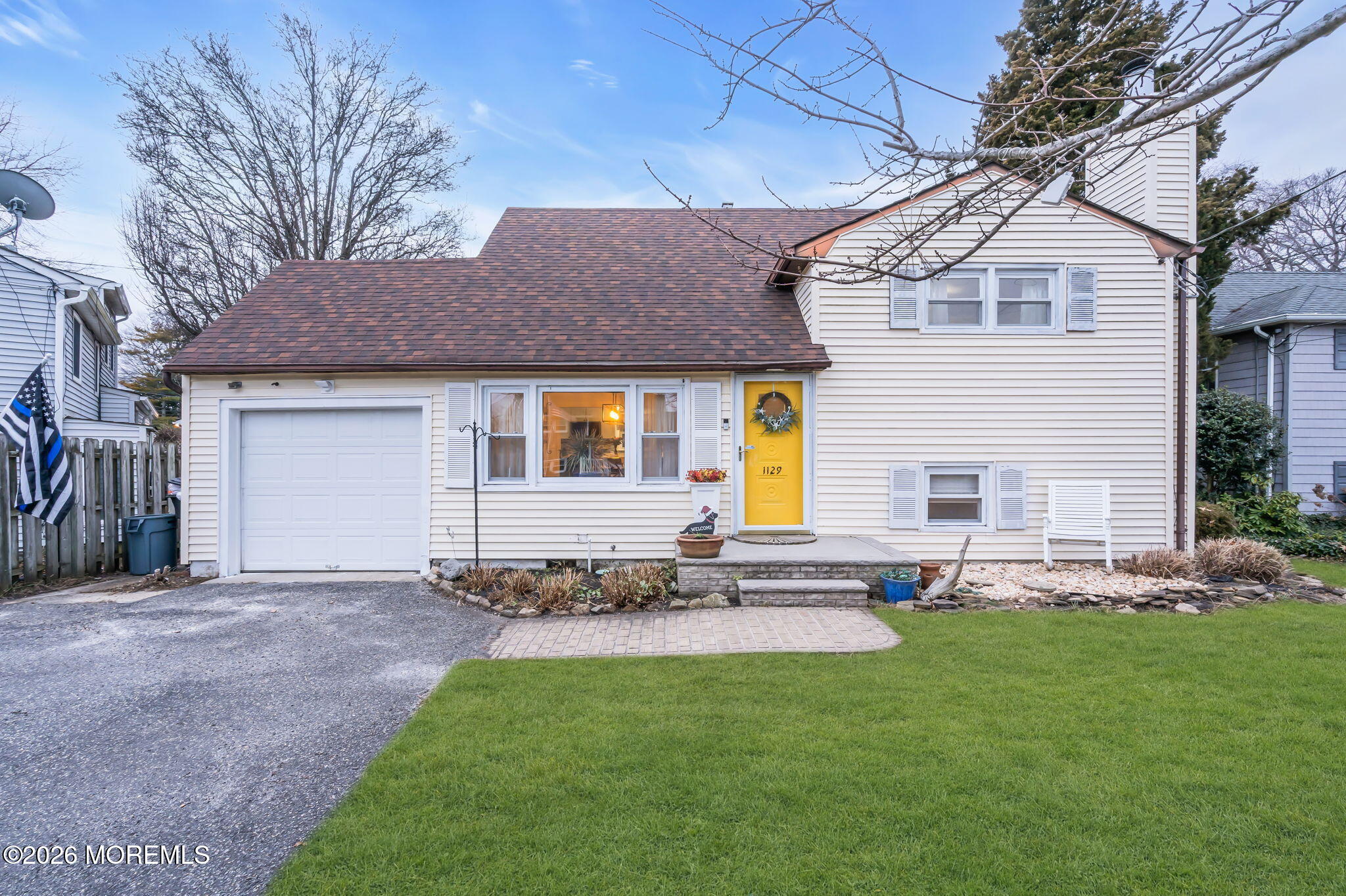 1129 Roe Avenue Point Pleasant, NJ 08742 - Photo 6 of 71 a front view of house with a garden and plants