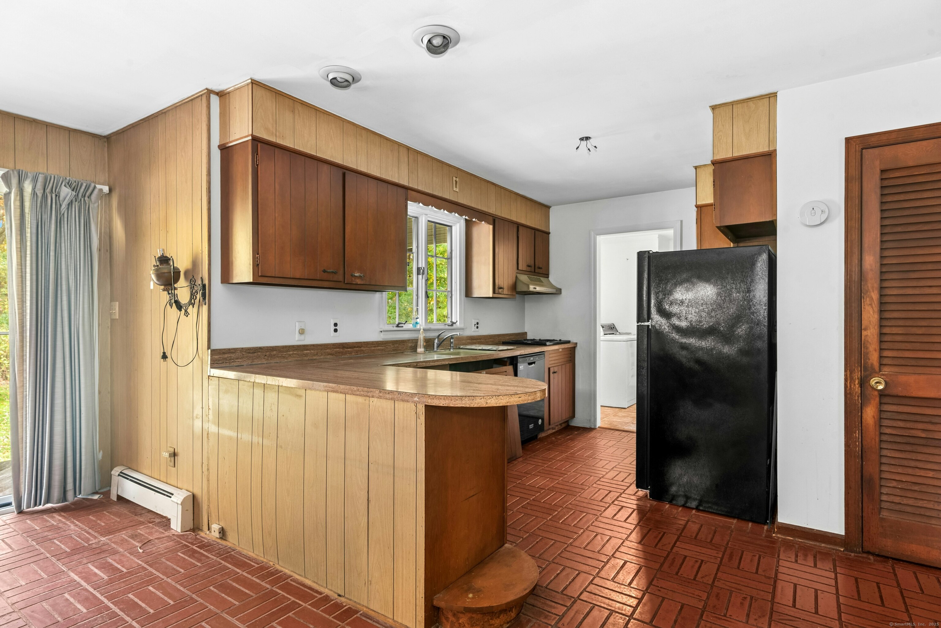 340 Moose Hill Road Monroe, CT 06468 - Photo 11 of 21 a kitchen with a refrigerator and a sink