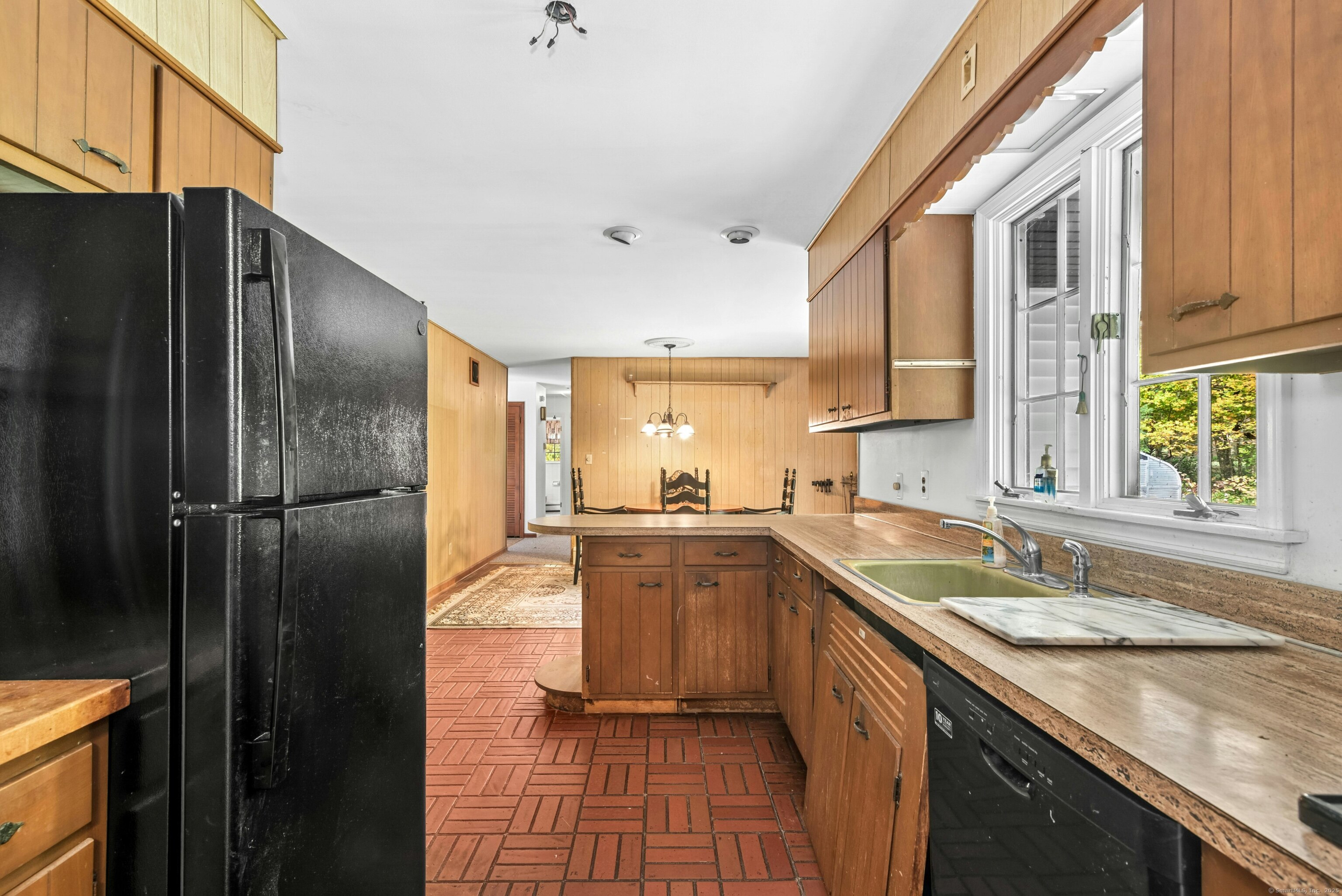 340 Moose Hill Road Monroe, CT 06468 - Photo 12 of 21 a kitchen with a sink a counter top space stainless steel appliances a refrigerator and cabinets