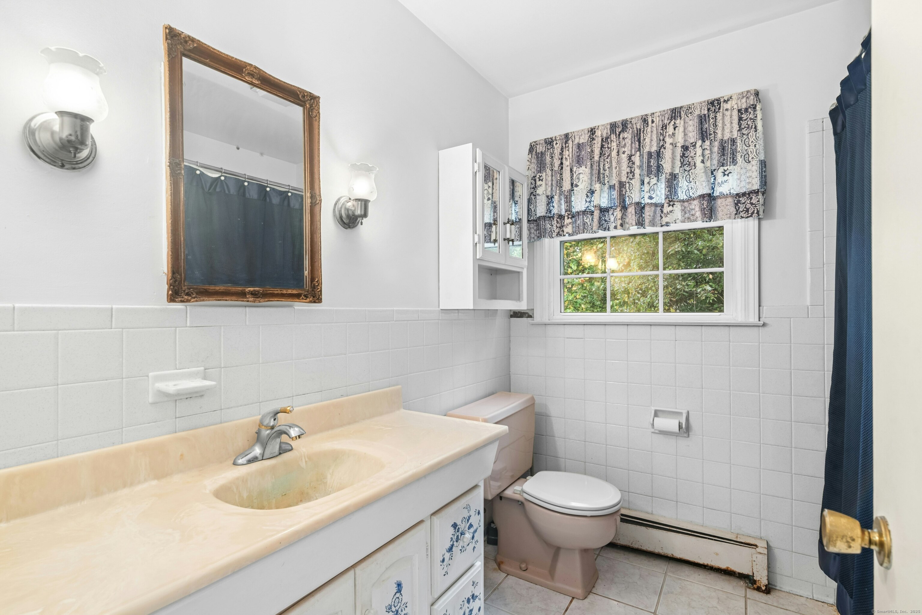 340 Moose Hill Road Monroe, CT 06468 - Photo 17 of 21 a bathroom with a sink a toilet and mirror