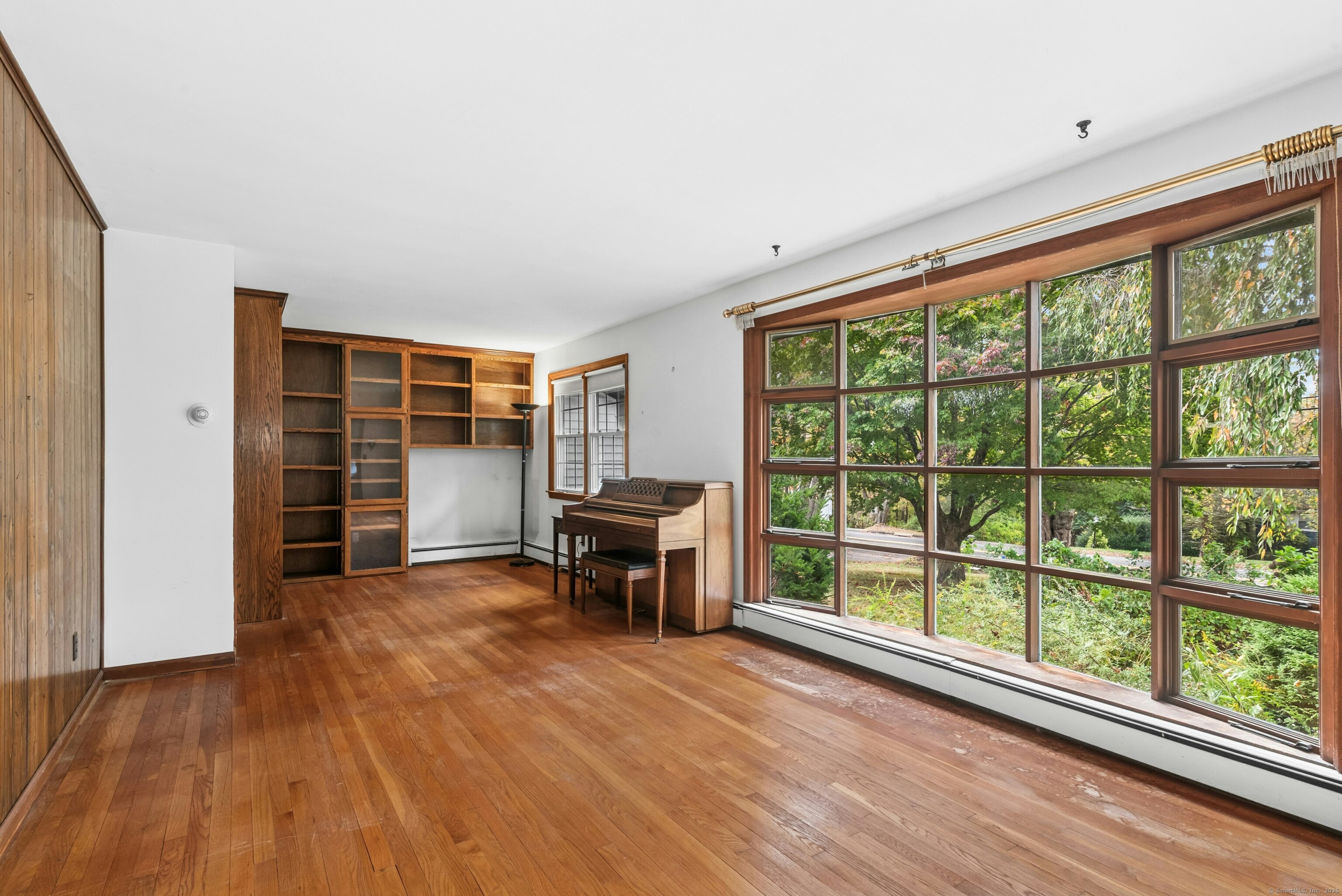 340 Moose Hill Road Monroe, CT 06468 - Photo 8 of 21 wooden floor in an empty room with a window