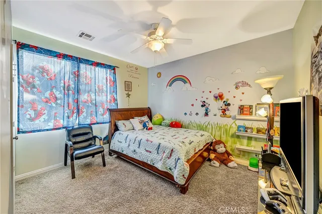a spacious bathroom with a granite countertop sink and a mirror