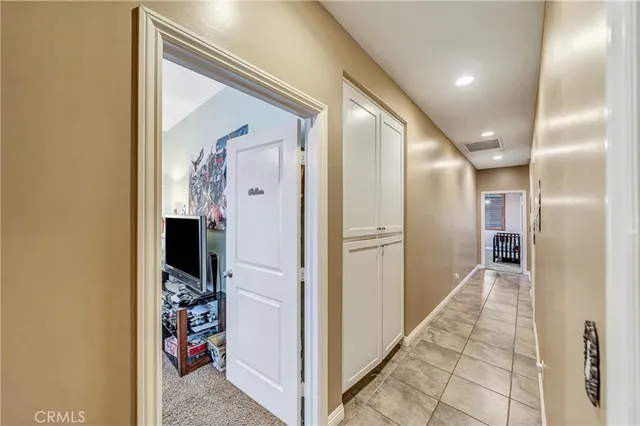 a spacious bathroom with a granite countertop sink and a mirror