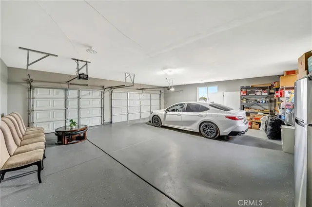 a view of a house with a yard and garage