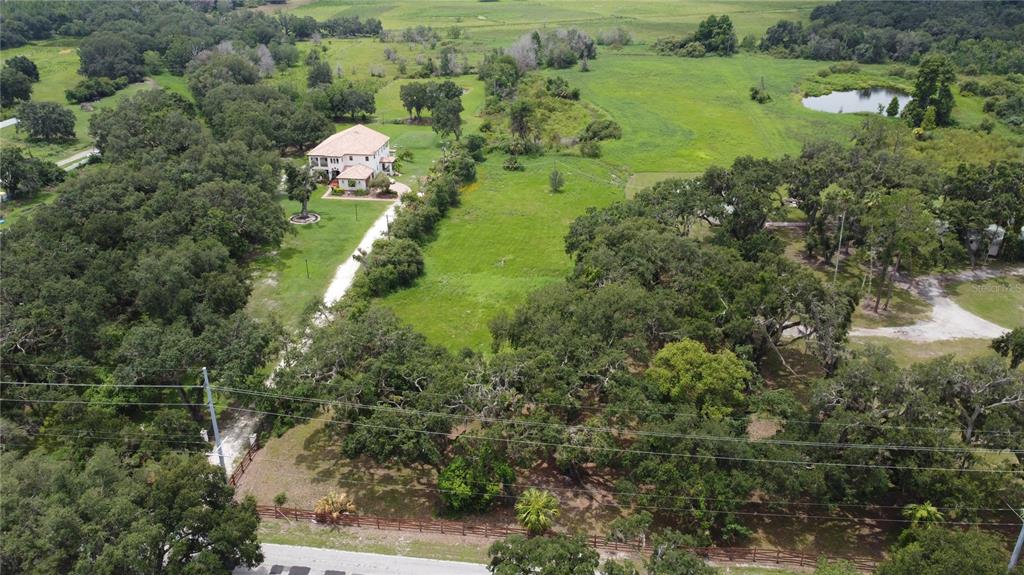 6501 Muck Pond Road Seffner, FL 33584 - Photo 15 of 21 a aerial view of a house with a yard