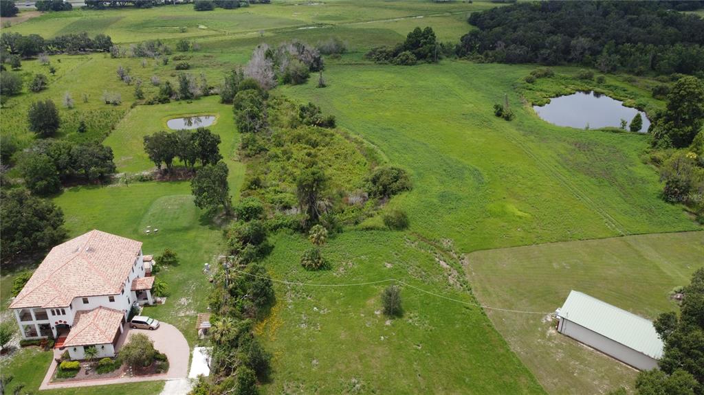 6501 Muck Pond Road Seffner, FL 33584 - Photo 17 of 21 an aerial view of a house with a yard