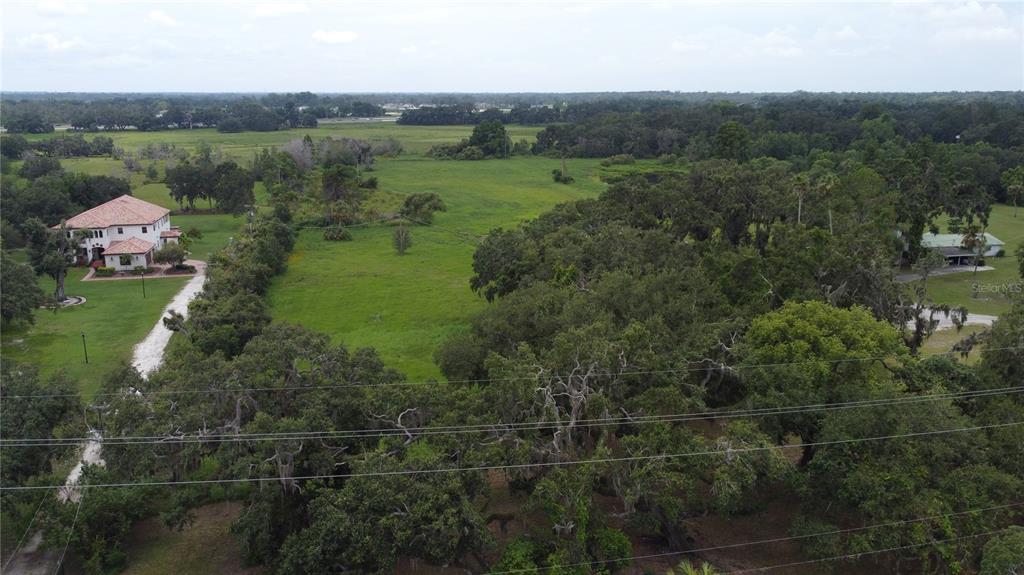 6501 Muck Pond Road Seffner, FL 33584 - Photo 20 of 21 an aerial view of a house with yard
