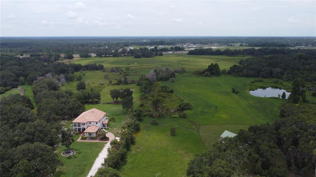 6501 Muck Pond Road Seffner, FL 33584 - Photo 7 of 21 a view of a lake with a mountain in the background