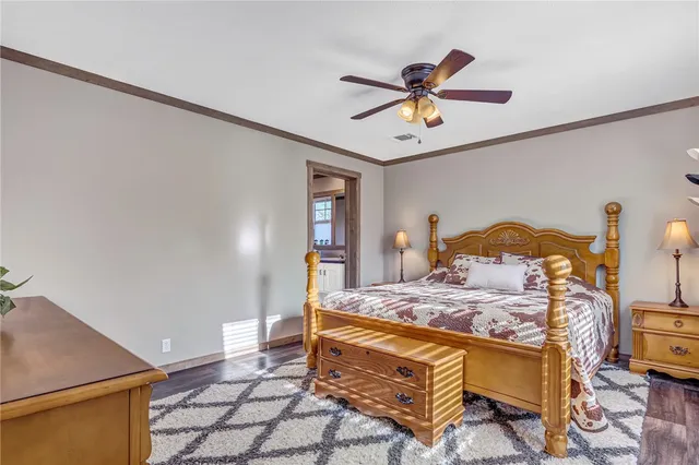 a kitchen with a table chairs refrigerator and cabinets