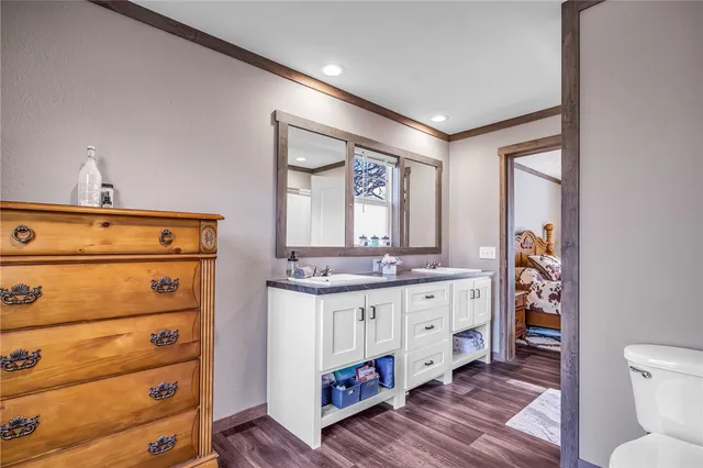 a bathroom with a double vanity sink and a mirror