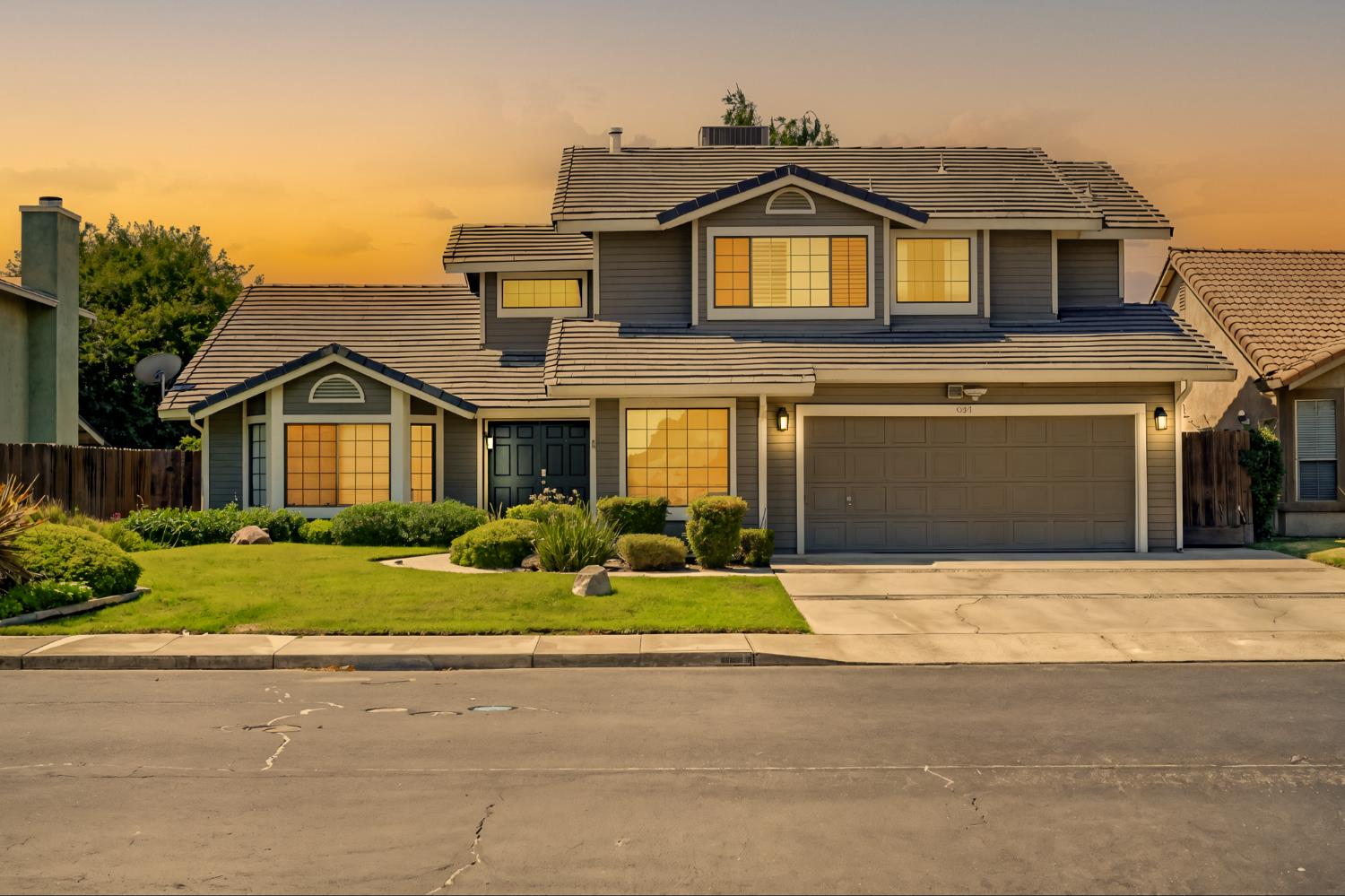 834 Cedar Ridge Drive Turlock, CA 95382 - Photo 1 of 57 a front view of a house with a yard and garage