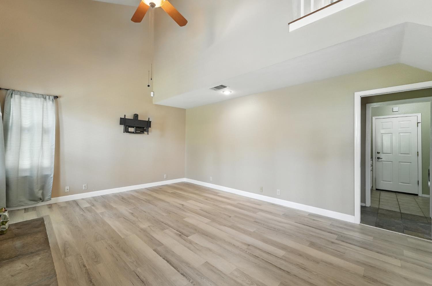 834 Cedar Ridge Drive Turlock, CA 95382 - Photo 28 of 57 an empty room with a empty space and a ceiling fan