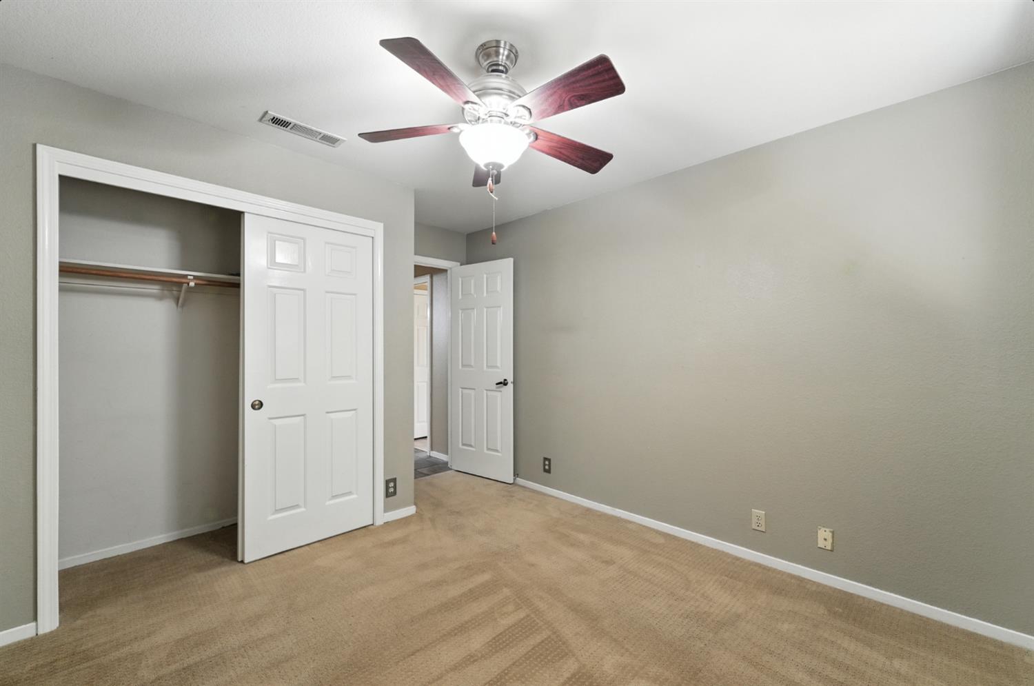 834 Cedar Ridge Drive Turlock, CA 95382 - Photo 29 of 57 an empty room with closet and windows