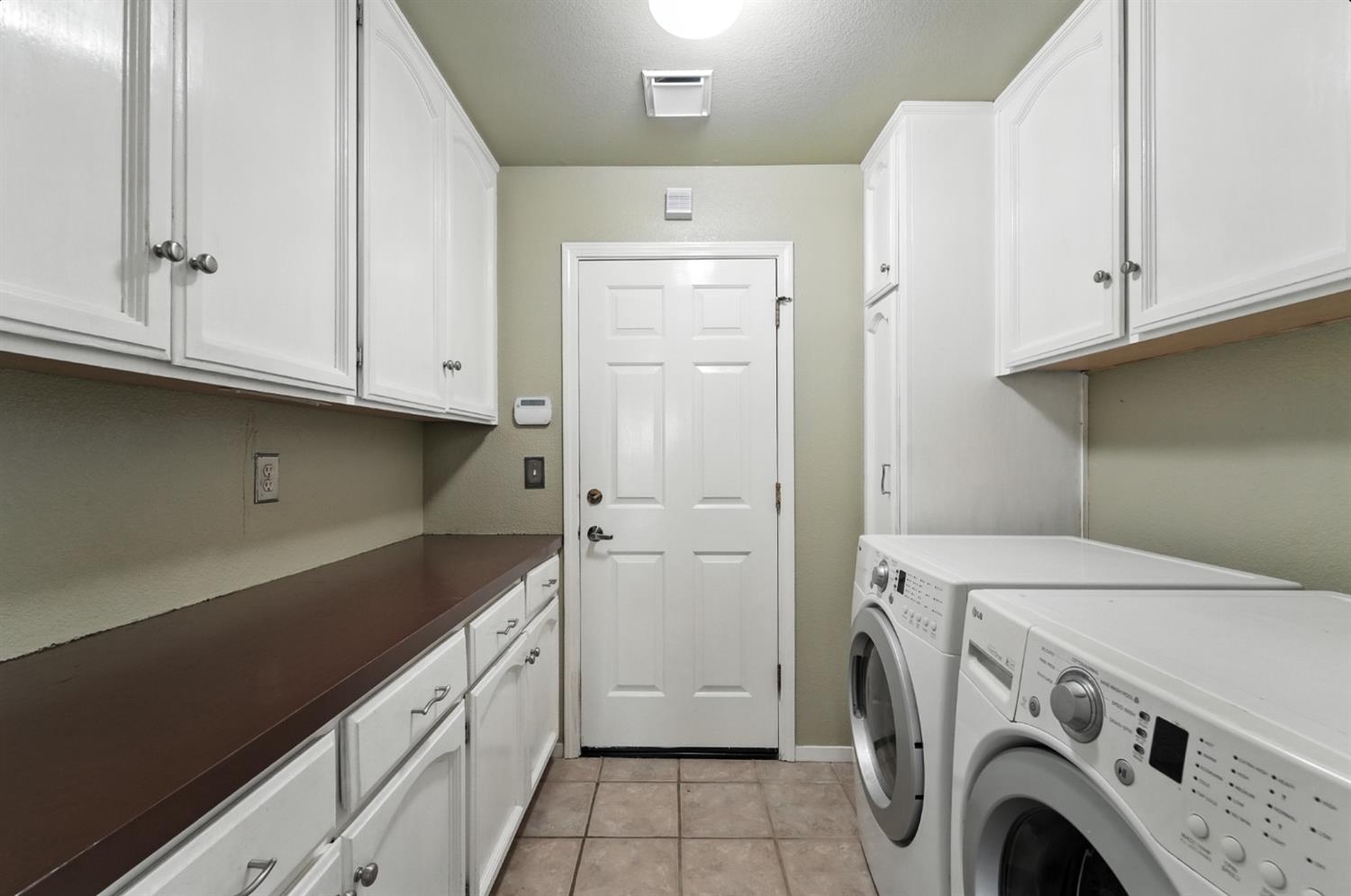 834 Cedar Ridge Drive Turlock, CA 95382 - Photo 32 of 57 a utility room with dryer and washer