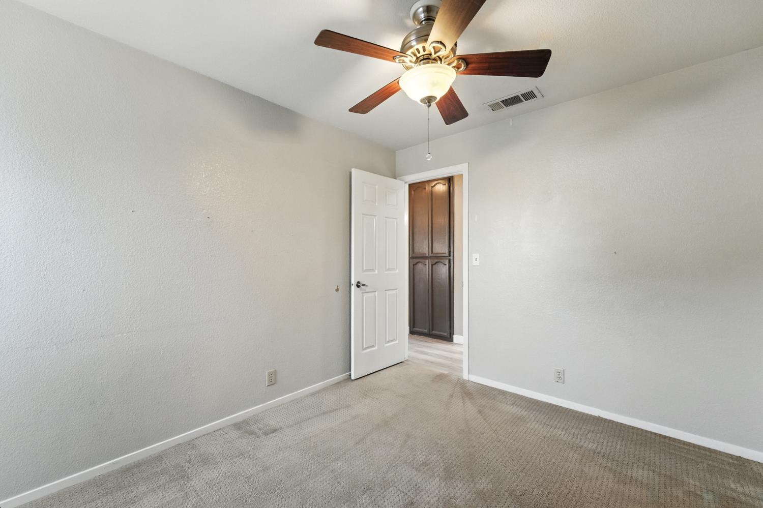 834 Cedar Ridge Drive Turlock, CA 95382 - Photo 36 of 57 an empty room with a ceiling fan and a fan