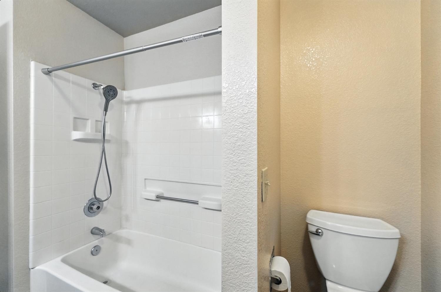 834 Cedar Ridge Drive Turlock, CA 95382 - Photo 40 of 57 a bathroom with a shower and a toilet in it