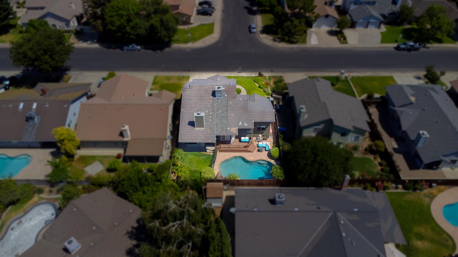 834 Cedar Ridge Drive Turlock, CA 95382 - Photo 4 of 57 an aerial view of house with yard swimming pool and outdoor seating