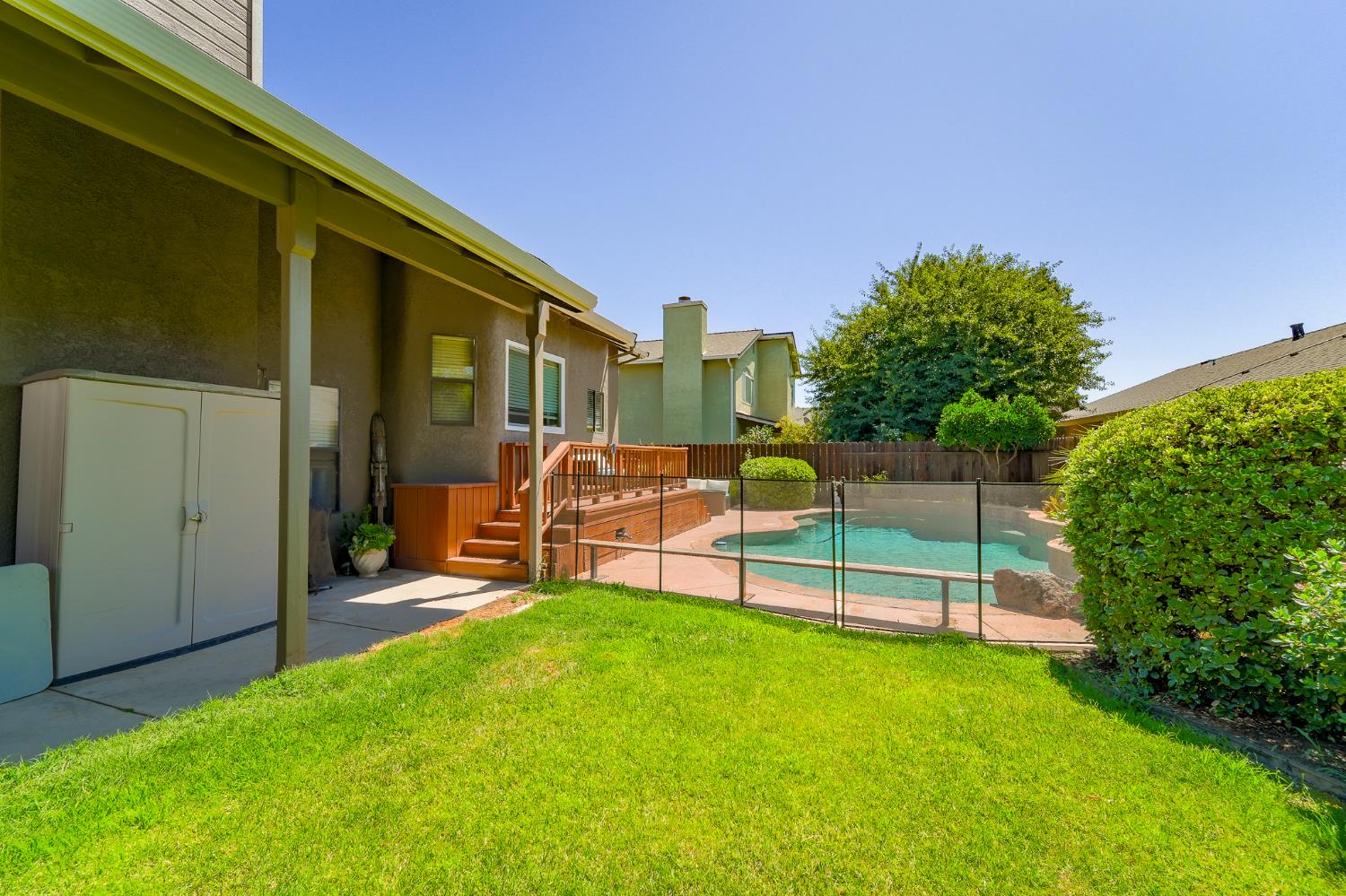 834 Cedar Ridge Drive Turlock, CA 95382 - Photo 54 of 57 a view of a chair and table in backyard of the house