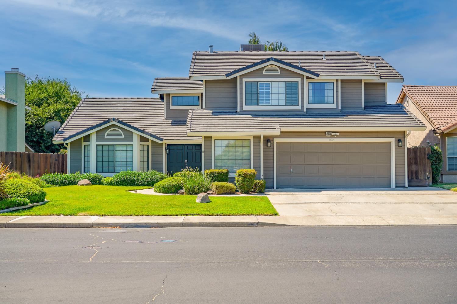 834 Cedar Ridge Drive Turlock, CA 95382 - Photo 7 of 57 a front view of house with yard and green space