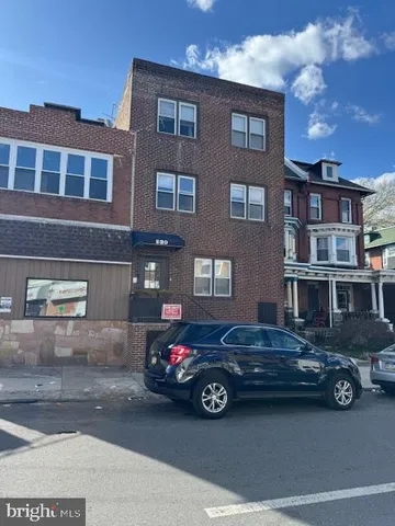 a car parked in front of a building