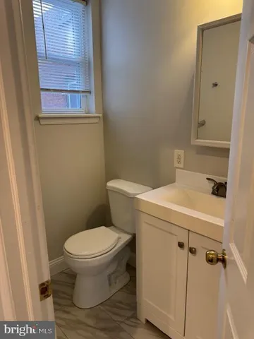 a bathroom with a toilet and a sink