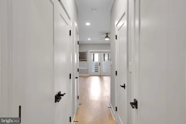 a view of a hallway with a bathroom