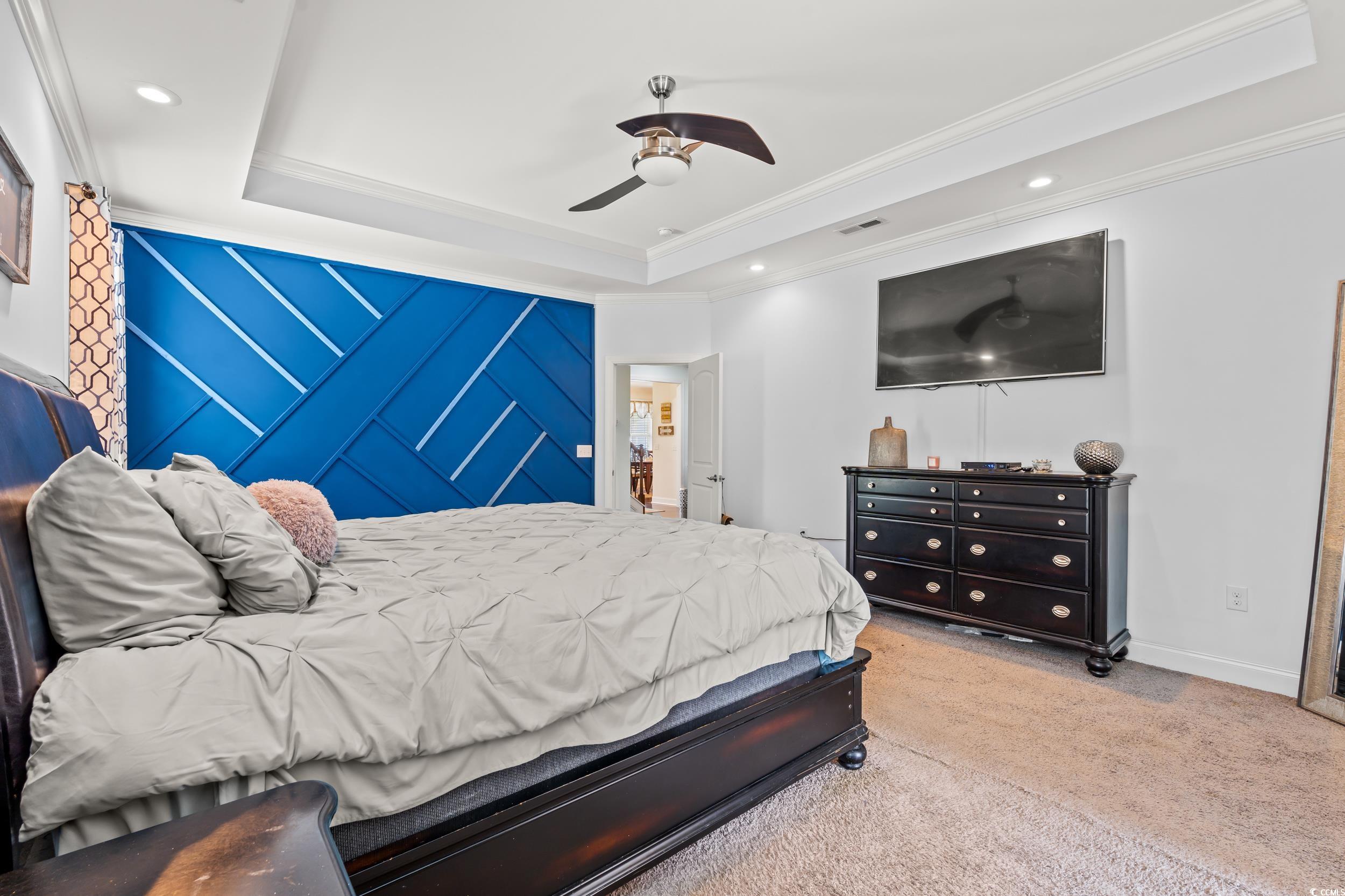 1051 Academy Drive Conway, SC 29526 - Photo 12 of 37 Carpeted bedroom featuring a tray ceiling, ornamental molding, baseboards, recessed lighting, and a ceiling fan