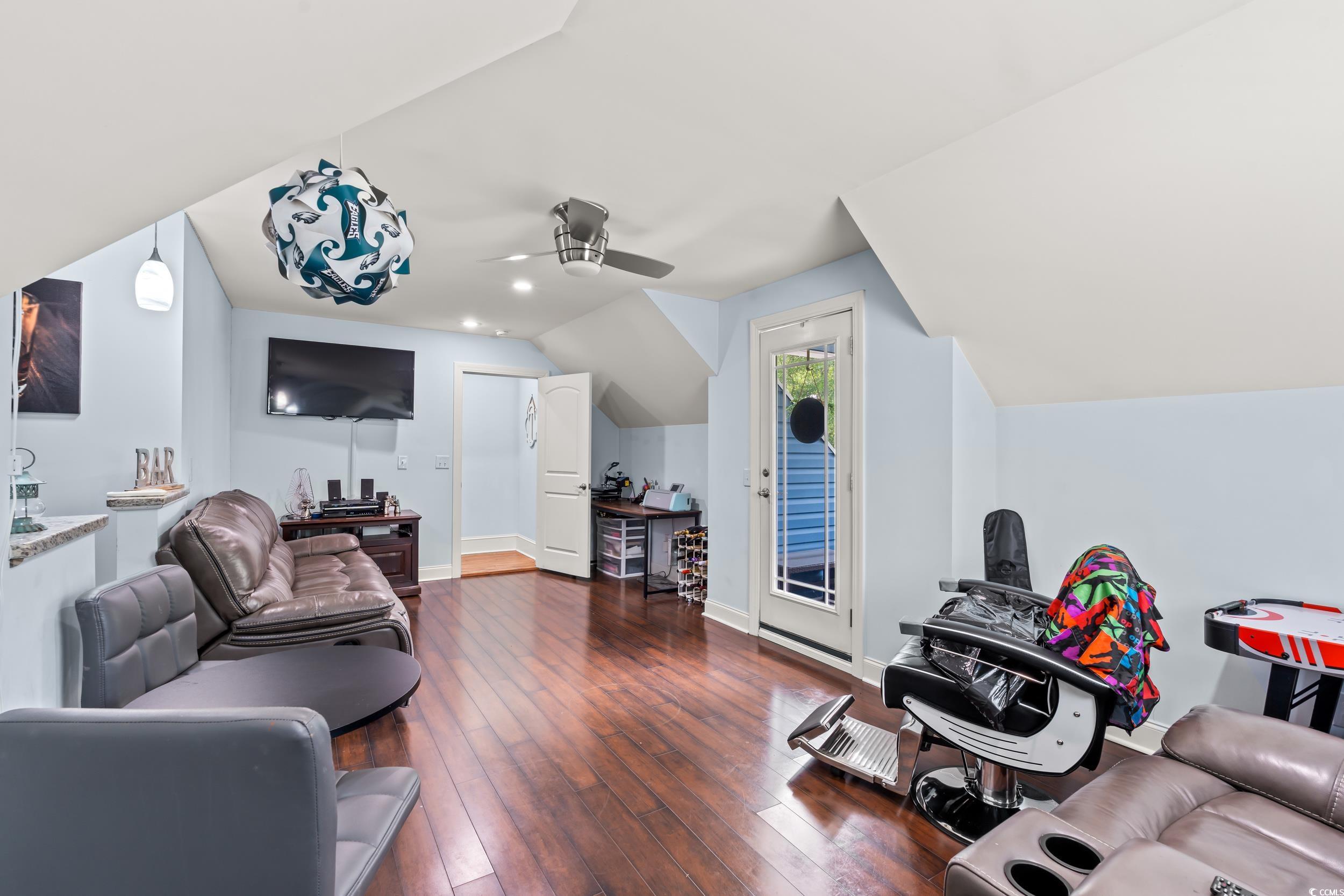1051 Academy Drive Conway, SC 29526 - Photo 18 of 37 Living room featuring ceiling fan, dark wood finished floors, lofted ceiling, and baseboards
