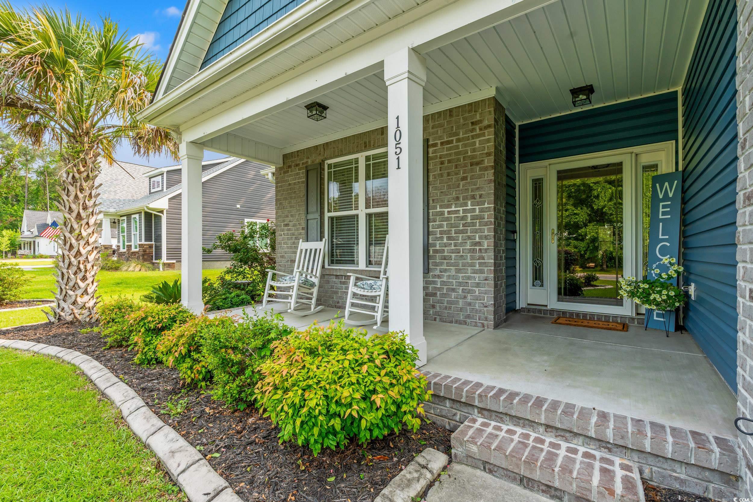 1051 Academy Drive Conway, SC 29526 - Photo 29 of 37 View of exterior entry featuring brick siding and a porch