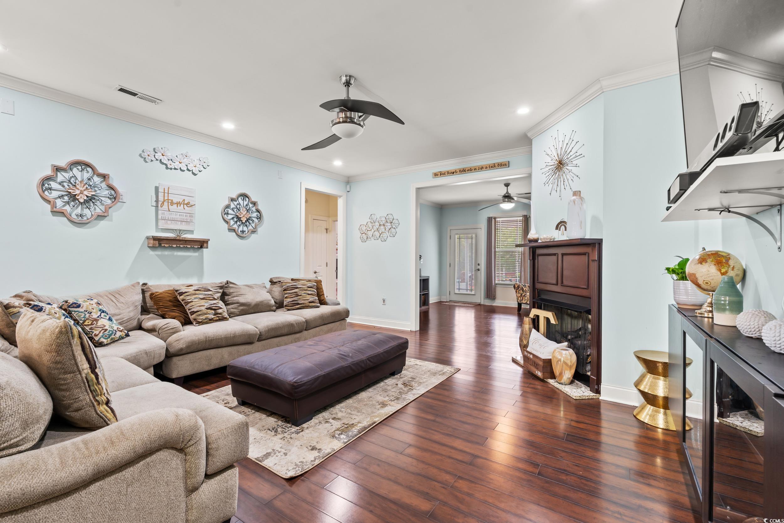 1051 Academy Drive Conway, SC 29526 - Photo 5 of 37 Living room with a ceiling fan, recessed lighting, ornamental molding, dark wood-type flooring, and baseboards